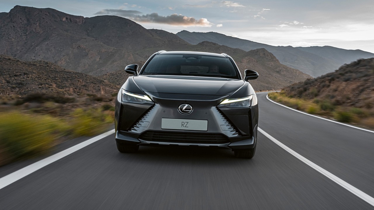 Front view of the Lexus RZ 450e driving in a rural location